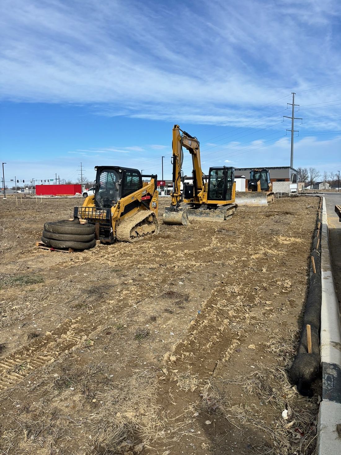 BD Excavation equipment staged on a commercial jobsite