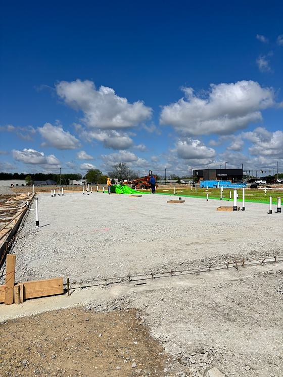Prepared stone building pad with footing forms set on a BDX commercial site